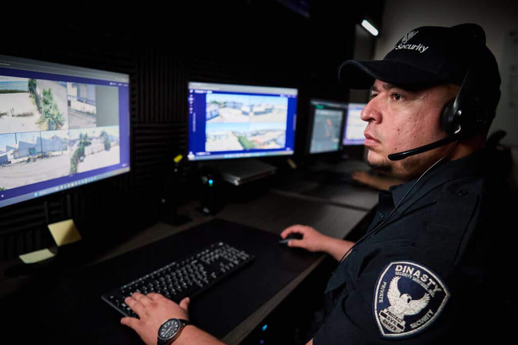 guard in front of a security system computer
