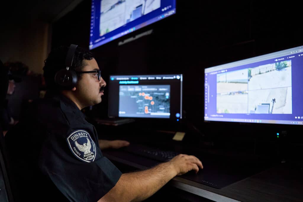 Dinasty Security Officer in front of system